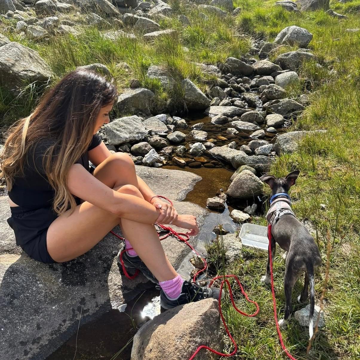 Sophia outdoors on a Wicklow trail with a dog — placeholder for real photography
